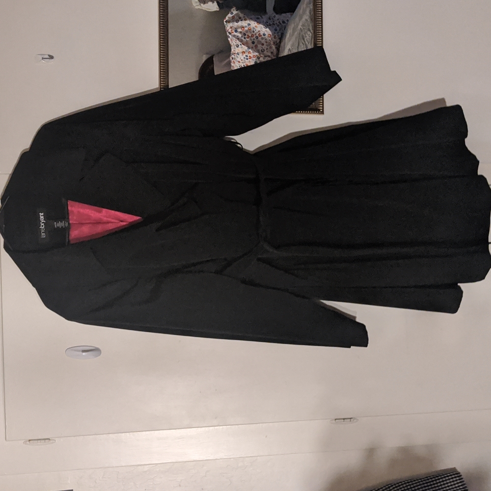 Black trench coat with red interior lining.